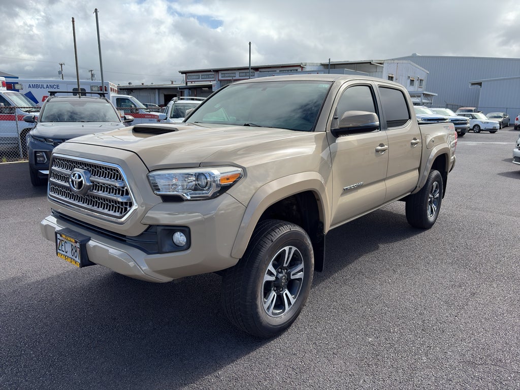 2016 Toyota Tacoma TRD Sport in Quicksand — front three-quarter view