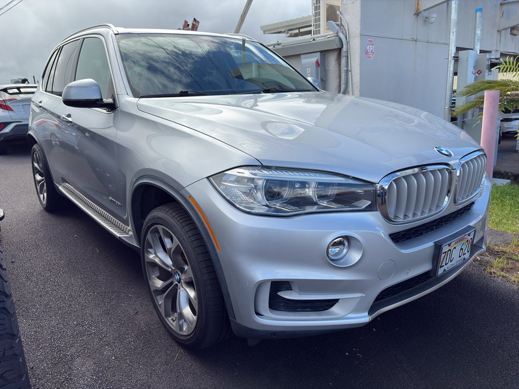 2015 BMW X5 sDrive35i in Imperial Blue Metallic — front three-quarter view
