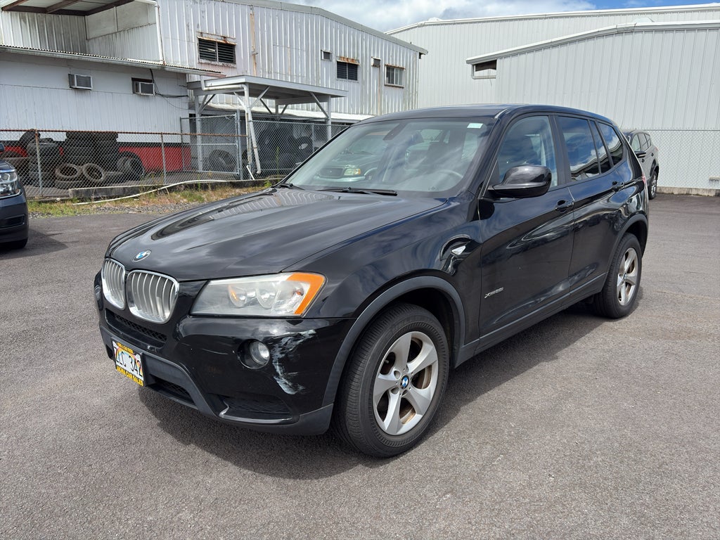 2011 BMW X3 28i in Jet Black — front three-quarter view